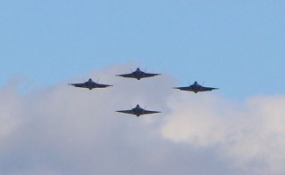 Four F-35s fly in formation over the hanger Wednesday.